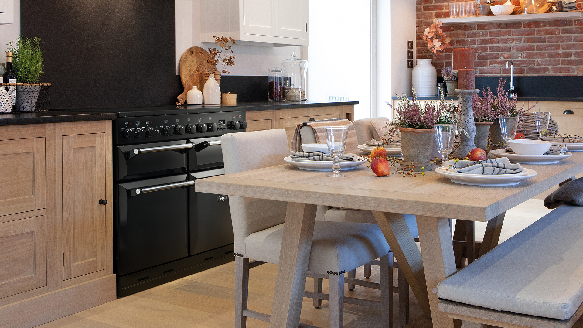 AGA Masterchef Deluxe 110 with induction in Black with wooden cabinetry 